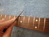 smoothing the fret ends&nbsp;&copy;&nbsp;2026&nbsp;42nd Street Guitars